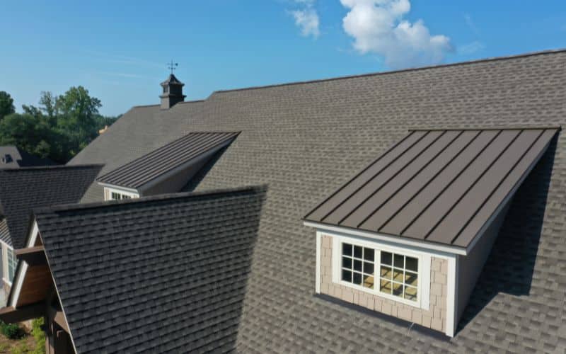 Metal Ridge Cap on Shingle Roof